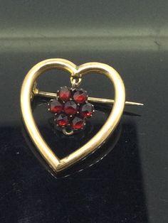 Antique 9CT Heart brooch C clasp with drop flower rose cut garnet very beautiful and different truly a gem in excellent condition measuring 2.5cm x 2cm All pieces are unique I aim to provide you with a 5 star service and customer satisfaction is my priority. All my items are vintage and pre owned so at times they will have signs of age but I try my very best to describe them with accuracy. Your purchase will be carefully packed to protect it. If you wish it wrapped as a gift for someone then do let me know please. Anniversary Flower Brooch Jewelry, Elegant Brooch For Valentine's Day, Anniversary Flower Shaped Brooch, Anniversary Flower Shaped Brooch Jewelry, Vintage Brooch For Valentine's Day Formal, Elegant Flower Brooch For Valentine's Day, Elegant Flower Brooches For Valentine's Day, Antique Gemstone Brooches For Anniversary, Vintage Brooch Jewelry For Valentine's Day