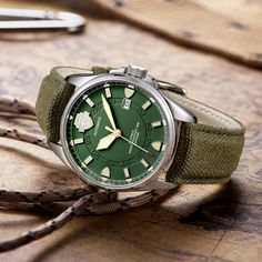 Created to ensure complete accuracy, this military green army watch for men is equipped with the automatic self-wind movement. Designed in a round case made from stainless steel, it comes with a sapphire crystal window that offers maximum protection. Furnished with a canvas band which is secured with a buckle clasp, this water-resist watch even has features like complete calendar and luminous hands. Luxurious but practical, get it now!

Specifications
Brand Name: GeraldBlack
Water Resistance Dep Wind Movement, Army Watches, Military Watches, Watch For Men, Mens Luxury, Black Watch, Mechanical Watch, Automatic Watch, Military Green