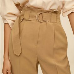 Belt Flowy Trousers Cropped Design, High Waist, Dart Detail, Flowy Fabric, Two Side Pockets, Two Welt Pockets On The Back, Loops, Belt Buckle Fastening, Concealed Button, Hook And Zip Fastening.. Viscous Polyester Beige Belted Bottoms For Work, Casual Beige Bottoms With Belt, Summer Trousers With Belt, Summer Pants With Belt, Flowy Trousers, Khaki Jumpsuit, Floral Palazzo Pants, Mango Pants, Flare Blouse