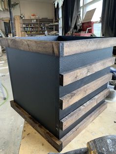 a wooden box sitting on top of a table