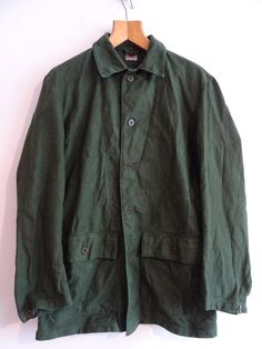 Vintage Swedish army jacket.  No modern UK size label- stamped C40 but please refer to the below measurements.   NOTE that the style is slightly tailored so it narrows at the waist- so please check them all not just the chest. All sales are final, no returns.  All cotton.  A racing/ forest green colour. Unlined, button closure and two flapped button pockets.  Previously laundered but is creased all over having been stored for a few years. Will need to be laundered before wear, certainly ironed! Green Cotton Outerwear With Patch Pockets, Green Cotton Utility Jacket With Buttoned Pockets, Green Workwear Outerwear With Patch Pockets, Olive Cotton Outerwear With Patch Pockets, Military Cotton Outerwear With Lapel Collar, Military Style Cotton Outerwear With Lapel Collar, Green Cotton Sport Coat With Pockets, Olive Cotton Outerwear With Pockets, Green Button-up Cotton Blazer