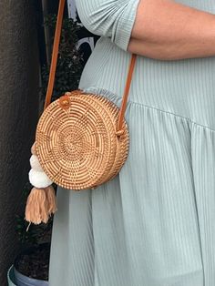 Functional and stylish, this summer essential Rattan Straw Circle Tote Handbag from Made Terra, makes a perfect go-to essential. Hand crafted with straw in a round shape, this tote handbag adds an artisanal touch to your accessory collection. The main compartment offers ample space for your wallet, cell phone and other belongings. And with the shoulder strap, this natural tote handbag offers easy carrying and pairing with your outfits. Measurement: 8" Inch x 2.8"Inch Materials: Straw, Genuine Le Straw Crafts, Rattan Bag, Summer Essential, Tote Handbag, Summer Essentials, Tote Handbags, Round Shape, Straw Bag, This Summer