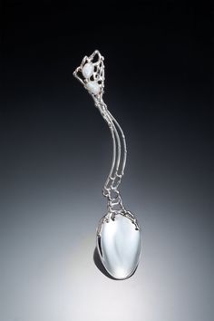 a glass object is hanging on a chain