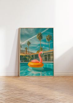 a flamingo floating on an inflatable pool floater with palm trees behind it