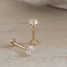 "⚡️ FREE SHIPPING ⚡️ on Domestic orders over $35 🇺🇸 Comfortable and easy to wear, these gorgeous diamond CZ studs are set in 14k gold (not plated). The perfect everyday accessory. Sold individually or as a pair. * T H E * D E T A I L S *  * Solid 14K Gold, choose from yellow or white * Cubic Zirconia measures 2mm or 3mm * Post measures 18 gauge and 6mm long * Thoughtfully packaged & ready for gift giving! * Handmade, just for you, in our sunny California Studio * Our 365 Guarantee: Our jewelry Gold Piercings With Prong Setting For Anniversary, 14k Gold Wedding Jewelry With Screw Back, Wedding Jewelry In 14k Gold With Screw Back, Wedding 14k Gold Jewelry With Screw Back, Elegant Wedding Piercings With Prong Setting, Wedding Jewelry With 14k Gold Screw Back, Gold Hypoallergenic Wedding Piercings, Gold Hypoallergenic Piercings For Wedding, Classic Round Wedding Piercings