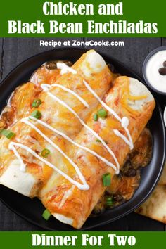 chicken and black bean enchiladas on a plate