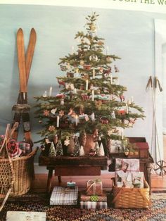 a christmas tree with skis and gifts under it