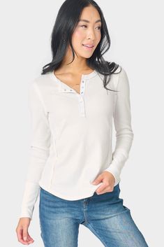 This closet-staple soft thermal henley features versatile snap-front buttons, raw-edged seam details, and a figure-flattering fit. Perfect on its own or as a layer. Created in collaboration with Lindsey of The Motherchic. 94% Polyester | 6% Spandex Delicate Wash Cycle, Dry Flat. Length 25 1/4" (size small) Jing is 5'8 and wearing size XXS Western Work, Women White Blouse, Essential Wardrobe, Layered Blouse, Henley Tee, Thermal Long Sleeve, White Button Down, Light Denim, Waffle Knit