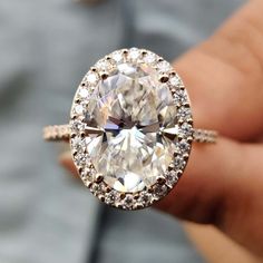 moissanite vs diamond - diamondrensu Unique Engagement Rings Halo, Moissanite Halo Engagement Ring, Halo Style Engagement Rings, Diamond City, Moissanite Engagement Ring Halo, Oval Cut Ring, Moissanite Engagement Ring Oval, Wedding Rings Halo, Moissanite Diamond Rings