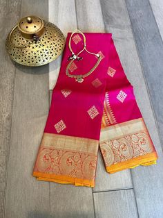 What can make your festive outfit more special than a pure, silk mark certified kanjivaram saree! This purekanchi pattu saree is handwoven with love by the hard working artisans back home. The shade of the saree is a pink, bordered by intricate peacock border and comes with zari work on the saree. Border and pallu are a mustard yellow shade and blouse is also the same contrast shade. Blouse piece is attached to the saree. Falls. pico and blouse stitching can be done for an extra price Silk mark certified kanjivaram silk saree | pure kanchi pattu saree online shopping usa | Kanchipuram silk | ethnic | silk mark saree | bridal kanjivaram | sarees for navratri Chanderi Saree With Temple Jewelry For Diwali, Festive Dola Silk Saree With Tilla Detail, Semi-stitched Tilla Dola Silk Saree, Festive Dola Silk Saree With Tilla Embroidery, Paithani Silk Saree With Pallu, Paithani Silk Saree With Pallu And Temple Jewelry, Festive Saree With Tilla Work, Art Silk Saree With Tilla For Diwali, Festive Saree With Tilla Details For Festivals