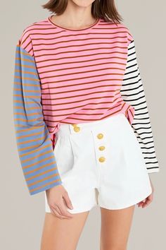 this colorful, pink multicolor long sleeve shirt combines a color block design and striped pattern that effortlessly creates a fun and comfortable top to pair with shorts or jeans. the breathable, soft fabric is perfect for warmer seasons or for laying under an oversize denim jacket. 95% cotton | 5% spandex hand wash cold | iron low | do not tumble dry model is wearing a size small model's measurements: 5'8.5" height, 32" bust, 24" waist, 34" hip Multicolor Striped Top For Summer, Pink Cotton Top With Contrast Stripes, Multicolor Vertical Striped Tops For Spring, Multicolor Tops With Contrast Stripes For Spring, Multicolor Long Sleeve Top With Vertical Stripes, Casual Pink Tops With Contrast Stripes, Spring Multicolor Vertical Striped Tops, Casual Multicolor Tops With Striped Sleeves, Pink Long Sleeve Top With Contrast Color