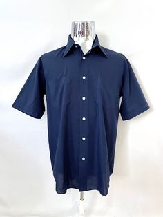 Vintage 70's Navy Blue, Short Sleeve, Shirt (L) by Freshandswanky on Etsy Navy Cotton Short Sleeve Shirt With Pockets, Navy Collared Short Sleeve Cotton Shirt, Navy Collared Cotton Short Sleeve Shirt, Navy Cotton Collared Short Sleeve Shirt, Navy Cotton Button-up Short Sleeve Shirt, Classic Navy Shirt With Pockets, Blue Shirt With Welt Pockets For Summer, Blue Collared Shirt With Welt Pockets, Blue Summer Tops With Welt Pockets