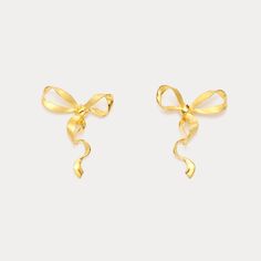 Who says everyday can't be charming? Gold Bow Earrings bring the coquette aesthetic with their classic ribbon design, meticulously designed with gleaming gold. Lightweight and comfortable, these high-quality earrings boast a smooth, shiny finish and long-lasting color. Effortlessly versatile, they pair perfectly with any outfit. Get ready to transform your everyday look from ordinary to oh-so-cute! DETAILS Plating: 18k Gold  Materials: 18k Gold on 925  Sterling Silver Size: 1.18"*0.98"(3.0cm*2.5 Gold Earrings With Decorative Bow As Gift, Elegant Gold Jewelry With Ribbon, Elegant Yellow Gold Jewelry With Ribbon, Gold Earrings With Decorative Bow For Formal Occasions, Formal Gold Earrings With Decorative Bow, Gold Ribbon Jewelry For Formal Occasions, Classic Gold Bow Earrings, Elegant Butterfly Knot Earrings For Formal Occasions, Elegant Gold Earrings With Decorative Bow