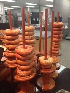 donuts are stacked on top of each other in the middle of a kitchen area