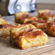 several pieces of cake sitting on top of a cutting board