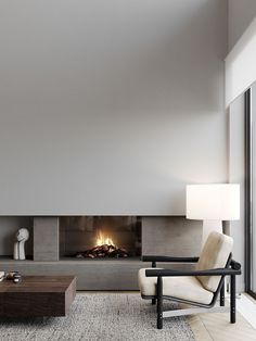 a modern living room with a fireplace and large windows