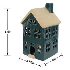 a blue ceramic house is shown with measurements