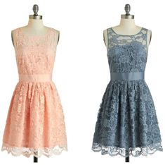 two dresses on mannequins, one in blue and the other in pink