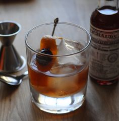 an alcoholic drink in a glass on a table