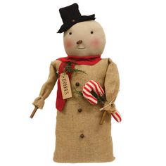 a small stuffed snowman with a red scarf and hat