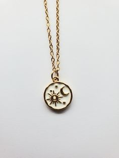 This beautiful sun and moon necklace a perfect treat for yourself or a gift for someone special. The gold plated celestial pendant is approximately .5" wide and .5" tall.  Perfect for layering necklaces or to wear as one necklace. Golden 304 Stainless Steel Satellite Cable Chain with Lobster Claw Clasp Rack plated brass enamel, long-Lasting Plated, Lead Free & Cadmium Free, Real 18K Gold Plated Colors may vary based on screen settings, lighting, etc.  Returns not accepted but please email me with any problems. Items sold in my shop are meant for adults only. Keep away from children. We are not responsible for allergic reactions. Stone, Gemstone Mineral necklaces are not promised to bring specific effects. Dainty Moon Phase Necklace For Everyday, Everyday Celestial Charm Necklace With Adjustable Chain, Minimalist Gold Necklace With Sun And Moon Design, Everyday Adjustable Sun And Moon Design Necklace, Dainty Sun And Moon Design Charm Necklaces For Everyday, Everyday Sun And Moon Design Round Pendant Necklace, Everyday Celestial Pendant Charm Necklaces, Celestial Charm Necklace With Round Pendant And Delicate Chain, Everyday Sun And Moon Design Round Pendant Necklaces