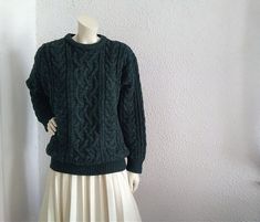 Vintage from the 1980s Materials: aran style sweater 80s cable knit sweater, wool sweater, chunky winter sweater, torsade sweater, crew-neck, aran fisherman style sweater, dark forest green, wool sweater unisex. GOOD VINTAGE CONDITION BUT THE ITEM IS NOT DRY CLEAN Measurements lying flat : shoulders :60 cm (23.5 inches) bust:56 cm (22 inches) total length :69 cm (27 inches) sleeve length :58 cm (23 inches) Green Wool Sweater, Fisherman Style, Sweater Chunky, Aran Sweater, Sweater Wool, Dark Forest Green, Vintage Cardigan, Winter Sweater, Cute Jackets