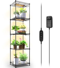 an electric planter is plugged in to a wall with plants on the shelves