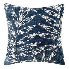 a blue pillow with white flowers on it