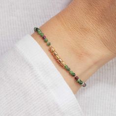 Embrace the beauty of vibrant semi-precious gemstones with our Green Gemstone Bracelet, perfect for adding a pop of color to your vacation jewelry collection. Pair with our Green Gemstone Necklace for a matching look.&nbsp;18K Champagne Gold PlatedChain length: 7, adjustable to 6.2Gemstone Rubis Zoisite: 0.1Sent with love in a complimentary gift box Green Gemstone Bracelet, Green Gemstone Necklace, Vacation Jewelry, Grandmother Gifts, Engraved Bracelet, Holiday Jewelry, Green Gemstones, Champagne Gold, Drop Necklace