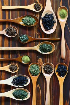 wooden spoons filled with different types of spices