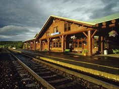 the train station is empty and ready for passengers to get on it's tracks