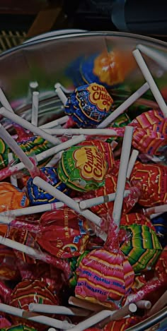 a bowl filled with lots of colorful candies