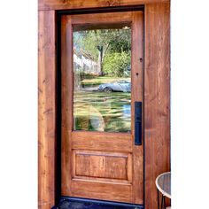 a wooden door with glass on the outside