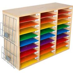 a multicolored storage unit with bins and dividers on the front side