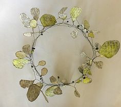 a wreath made out of leaves on top of a table