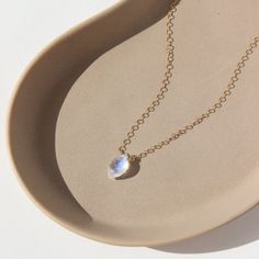 Our Faceted Moonstone Necklace is magical in every way. The delicate solid gold chain perfectly complements the marquise cut moonstone, radiating clarity and high vibrations with flashes of mesmerizing blue. Moonstone's feminine energy makes this necklace perfect for any goddess or those seeking a touch of celestial energy. DETAILSAvailable in 14k Solid GoldAvailable in 14", 16", and 18"Hypoallergenic, Nickel-Free, and Water Safe Delicate Moonstone Necklace With Delicate Chain, Dainty Moonstone Teardrop Pendant Necklace, Delicate Moonstone Necklace In Yellow Gold, Delicate Teardrop Moonstone Necklace, Minimalist Moonstone Jewelry With Adjustable Chain, Elegant Moonstone Necklace With Delicate Chain, Delicate Moonstone Gemstone Necklace, Minimalist 14k Gold Marquise Necklace, Moonstone Oval Pendant Necklace With Birthstone