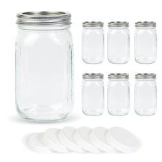 a set of mason jars with lids and plates