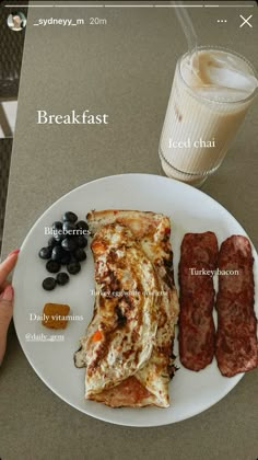 a white plate topped with food next to a glass of milk