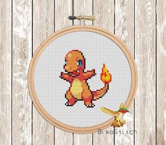 a cross stitch pattern with a cute little pokemon holding a yellow fire hydrant in it's right hand