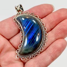 I Just Love The Mystical Internal Shine Of Labradorite! This Is A Large Crescent Moon Pendant. I Had The Stone Specially Cut For This Design. The Labradorite Is Large And Nice And Thick. The Internal Chatoyance Is Really Pretty And A Bit Unique As It Has A Lined Pattern To It. This Is Set Into A Sterling Bezel That Is Framed With A Twisted Silver Wire Accent. Sterling Scalloped Heart Loops Frame The Piece For More Detail. It Is Finished Off With A Beautiful Coordinating Bail! ***This Is One Of S Blue Mystical Moon Charm Jewelry, Mystical Blue Moon Charm Jewelry, Nickel-free Blue Labradorite Jewelry, Mystical Blue Labradorite Jewelry, Silver Labradorite Moon-shaped Jewelry, Blue Crescent Gemstone Jewelry, Angel Pendant Necklace, Silversmith Jewellery, Stone Statement Necklace