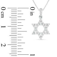 Faith meets fashion in this dazzling Star of David diamond pendant. Crafted in 18K white gold, this shimmering open design is fully lined with sparkling diamonds boasting a color rank of G and clarity of Si2. Striking with 1/6 ct. t.w. of diamonds and a brilliant buffed luster, this pendant suspends from a diamond-lined bail along an 18.0-inch box chain that secures with a spring-ring clasp. Star Of David Pendant, Gold G, Diamond Star, Open Design, Star Of David, White Stone, Sparkle Diamonds, Box Chain, Diamond Stone