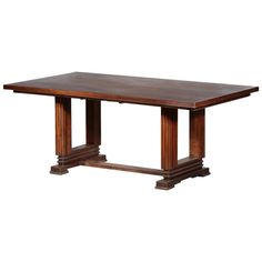 a large wooden table with two columns on each end and one column at the top