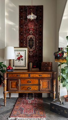 a living room with rugs, lamps and other items on the table in front of it