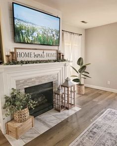 a living room with a fireplace and tv above it