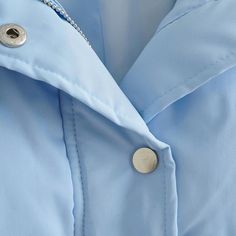 Our Fay Cropped Puffer Jacket in baby blue color will keep you warm and cozy while making you stand out thanks to its bright color. The jacket has a cropped length. elastic band at the bottom to block wind. a zipper closure and snap buttons. Solid Windbreaker For Cold Weather In Spring, Solid Windbreaker For Cold Spring Weather, Winter Blue Windbreaker With Zipper Closure, Blue Spring Outerwear Solid Color, Blue Solid Color Outerwear For Spring, Trendy Blue Windbreaker With Pockets, Blue Winter Puffer Jacket With Zipper Closure, Blue Puffer Jacket With Zipper For Winter, Blue Puffer Jacket With Zipper Closure For Winter