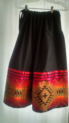 "Custom STOMP skirt with adjustable waist gathered skirt, with multicolor trim,ribbons,ric-rac, ready to get out and dance....Powwow, stomp, ceremony, performance, social... You will always be lookin good! Adjustable waist with drawstring type fabric belt, Fits waist and hips up 60\". If you want less fullness at waist, please indicate a 2-tier skirt! For sizes S,Med,L, XL ONLY! Please provide size and length of skirt in inches or cms.up to 32\" ( Thirty-two inches) long" Bohemian Black Skirt With Elastic Waistband, Black Bohemian Skirt With Elastic Waistband, Traditional Black Long Skirt, Traditional Long Black Skirt, Traditional Black Lined Skirt, Stomp Dance, Native American Ribbon Work, Powwow Outfits, Native American Dress