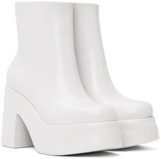 Ankle-high lightweight PVC boots in white. · Logo embossed at outer side · Zip closure at inner side · Logo printed at padded faux-leather footbed · Textured rubber interior · PVC platform midsole and block heel · Treaded PVC sole · Platform: H1.75 · Heel: H4 Supplier color: White White High Ankle Platform Boots, White Boots With Padded Ankle And Round Toe, White Heeled Boots With Padded High Ankle, White Waterproof Boots, White Synthetic Boots With Padded Heel, Modern White High Ankle Heeled Boots, White Synthetic Heeled Boots With Reinforced Heel, White Platform Ankle Heeled Boots, Modern White High-top Boots