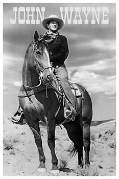 a black and white photo of a man on a horse with the words john wayne