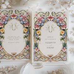 two wedding cards with floral designs on them