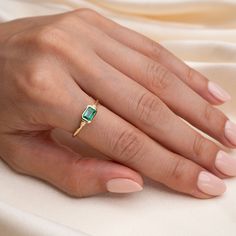 14k Emerald Pyramid Ring Symbolic of fertility, growth, rebirth and wisdom, the emerald has been revered by ancient cultures all over the world for its beauty and raw, natural power. Our 14k Vintage Emerald Ring is sure to be a statement on it's own. This ring features a 6x4mm genuine emerald set in a vintage setting, and adorned between two diamonds. .54 Emerald Carat Total Weight .002 Diamond Total Carat Weight Due to the handmade nature of this ring, please allow 1 - 3 weeks for processing. Solitaire Jewelry For Promise With May Birthstone, Emerald Cut Birthstone Jewelry For Promise, Stamped 14k Gold May Birthstone Ring, Yellow Gold Jewelry With Princess Cut Birthstone, Emerald Cut Yellow Gold Ring As A Gift, Princess Cut Yellow Gold Emerald Ring For Gift, Princess Cut Emerald Ring In Yellow Gold For Gift, Yellow Gold Princess Cut Birthstone Jewelry, Stamped 14k Jewelry For Promise Ring And May Birthstone